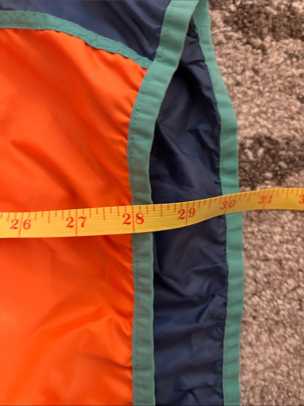 cotopaxi Navy Windbreaker with Orange and Yellow Colorblock
